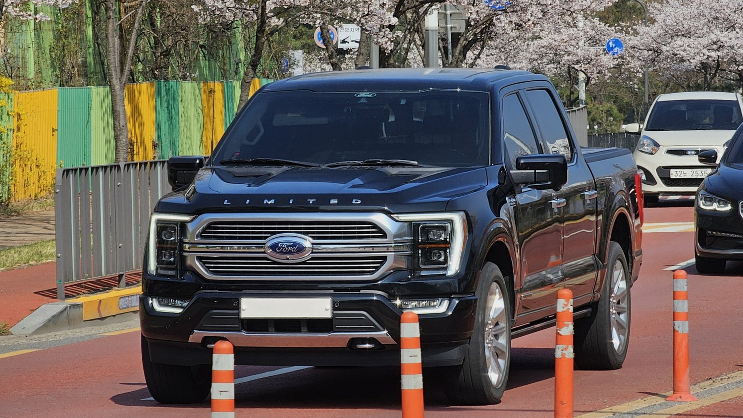 Black Ford F-150 Limited crew cab pickup truck, front view