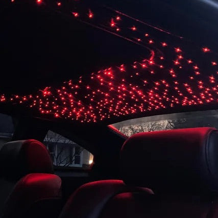 Car interior with red LED lights on the ceiling