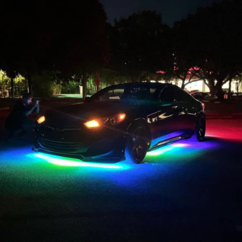 hyundai genesis Car with colorful underglow lights on a dark outdoor settining with under-body RGB lights/underglow fast and furious lights