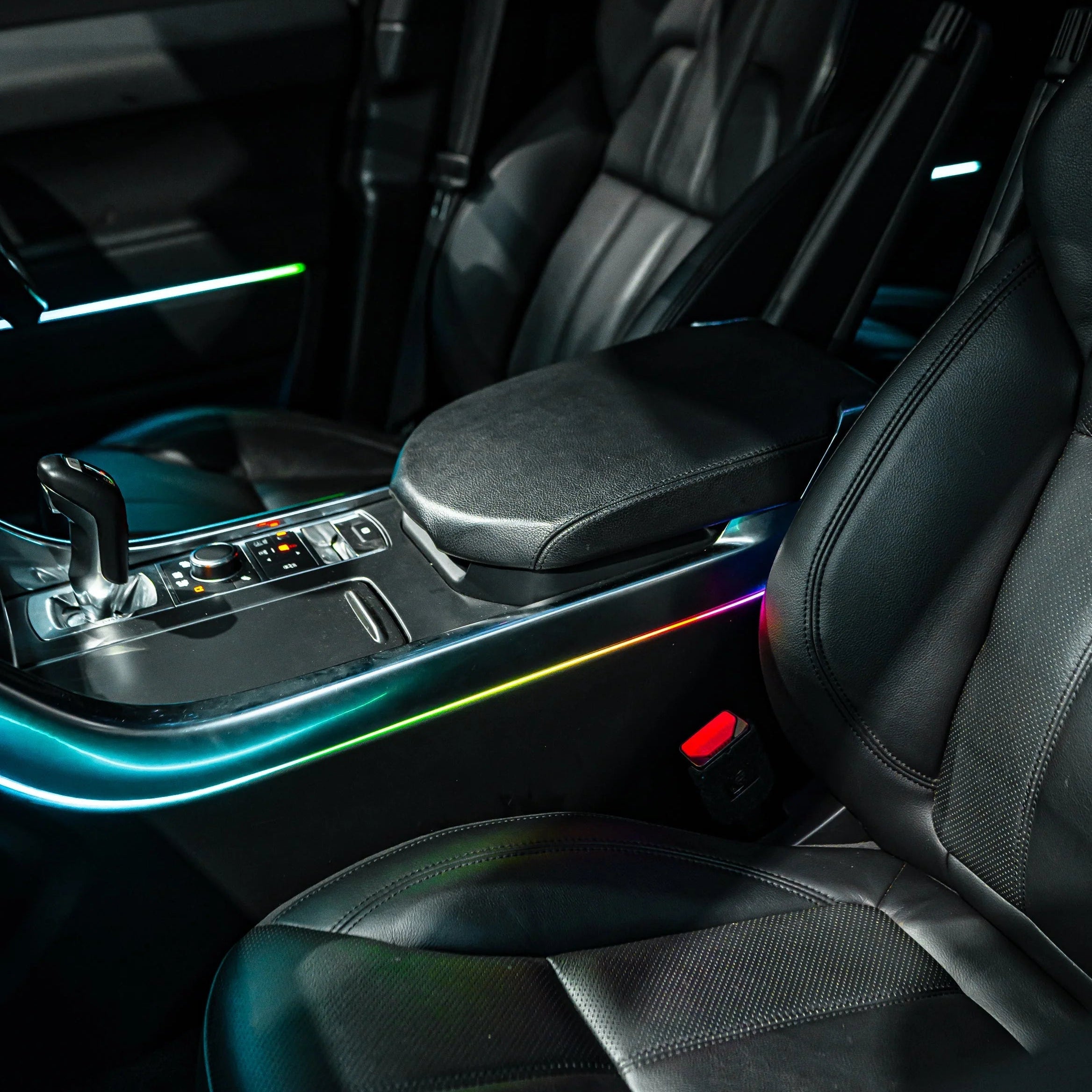 Close-up of a car's interior with illuminated Arm rest and seat.
showing ambient lighting kit 