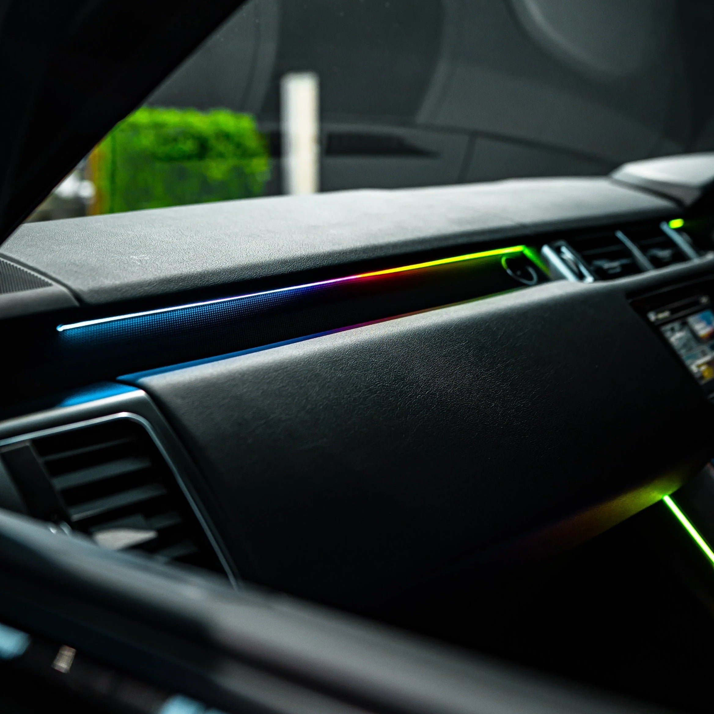 Car interior ambient Lighting with dashboard and air vents, showing a rainbow light Colour chasing effect.