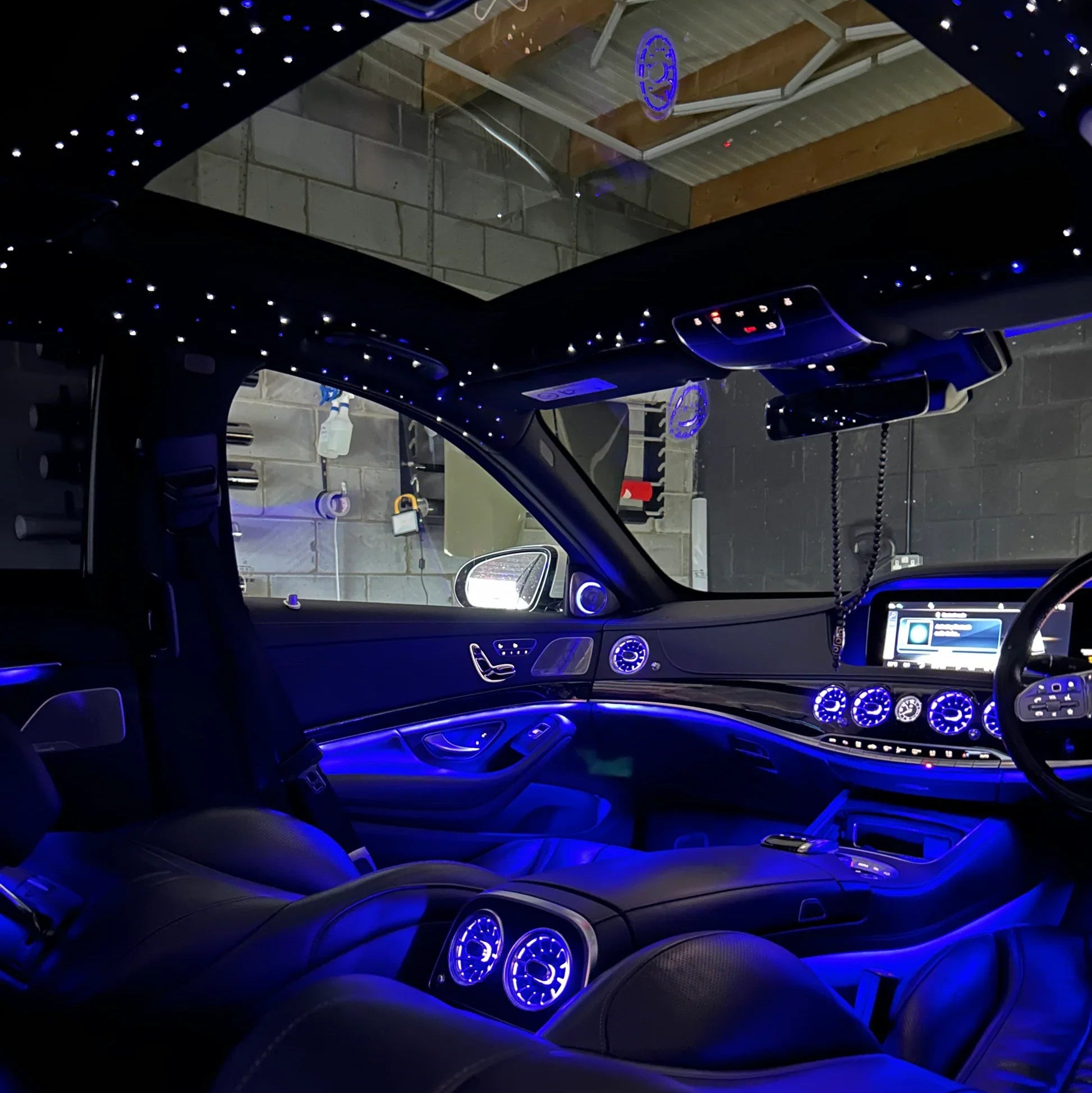 Luxury vehicle interior with blue LED lighting