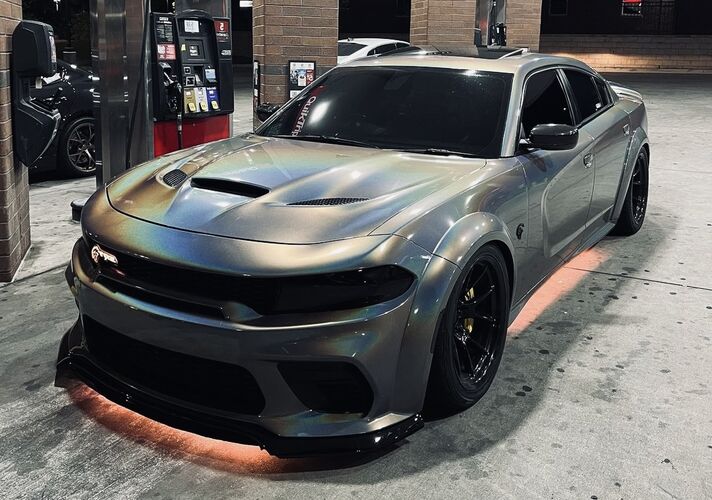 Silver Hellcat sports car with black accents on a concrete surface with under-body RGB lights/underglow fast and furious lights 