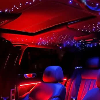 Galaxy bundle custom car interior lighting kit installed in Jeep Grand Cherokee SUV, featuring red ambient door strips contrasting with blue starlight headliner