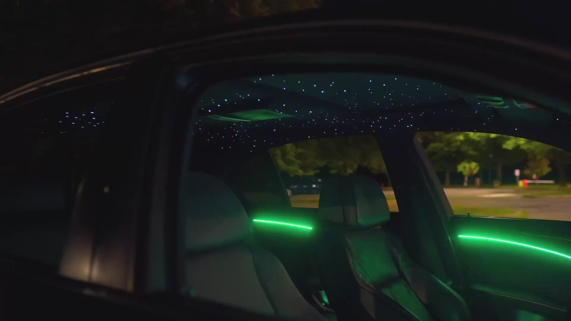 Cinematic video banner showcasing the complete Galaxy Bundle installation, featuring teal starlight headliner and matching ambient interior lighting viewed from the exterior at night